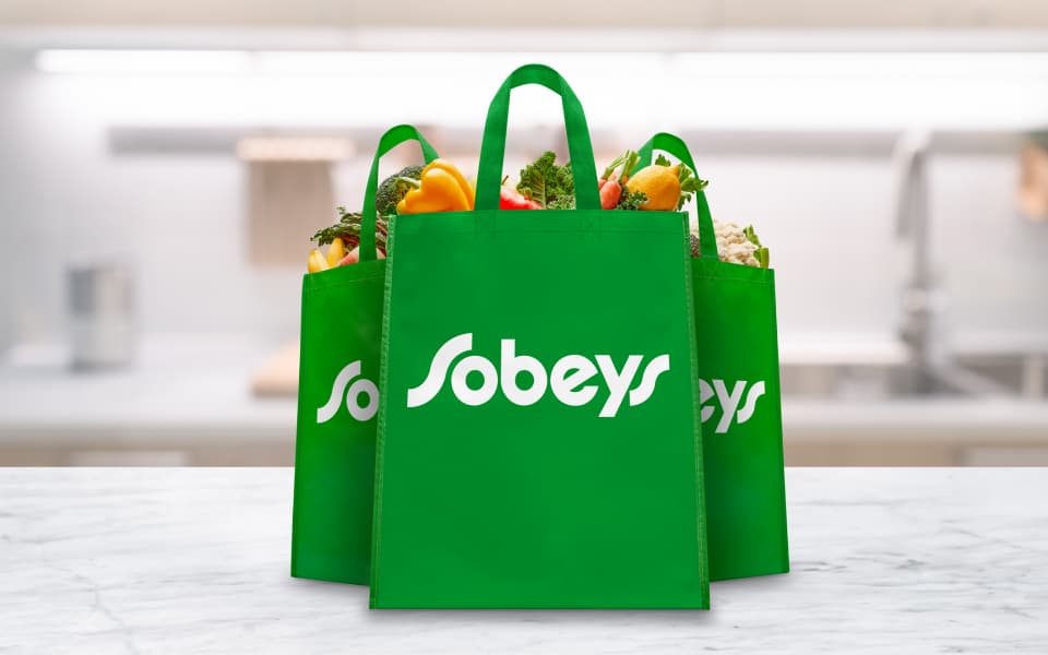 Modern recycled grocery bags with Sobeys logo on them